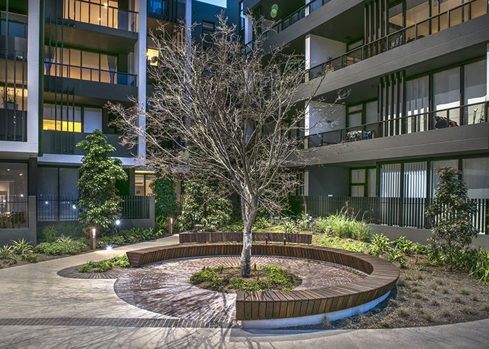 A custom 5.7 metre Arc Seat is a place for neighbours to meet in Harold Park.