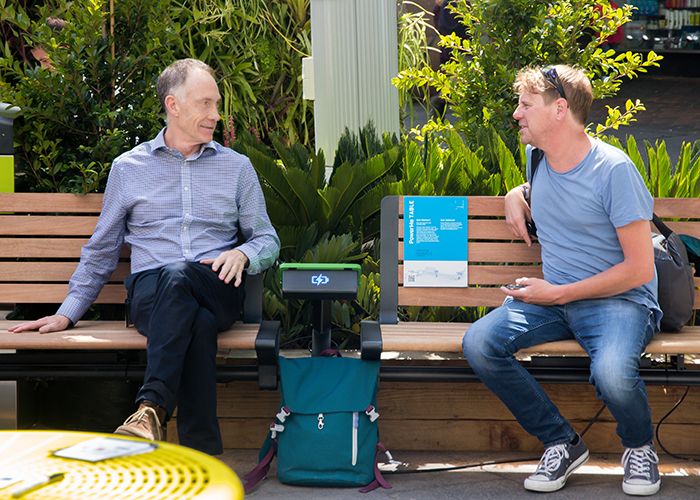 Chats over the PowerMe wifi charging table, on the ARIA seat.