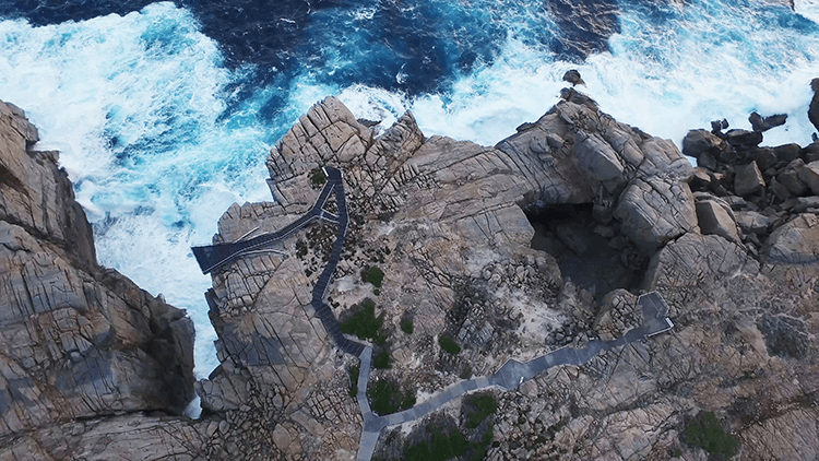Aerial view over The Gap (left) and Natural Bridge in Torndirrup National Park. Credit: WA Parks & Wildlife