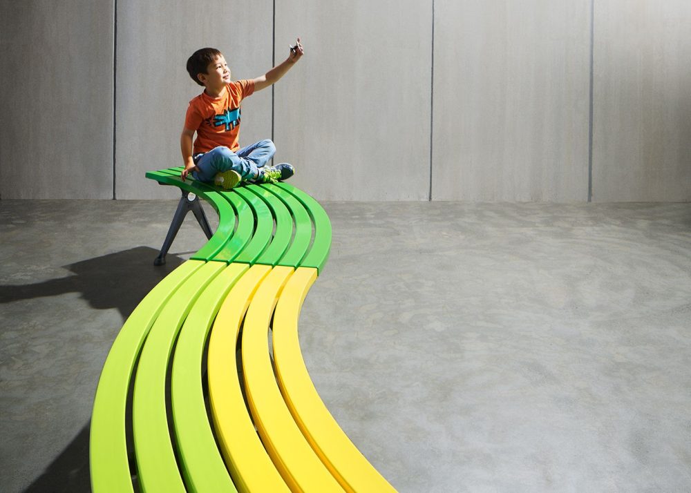Mall Curved Slim Bench with Sable Brilliance frame, battens in Viper Green, Lycra Strip and Brilliant Yellow.