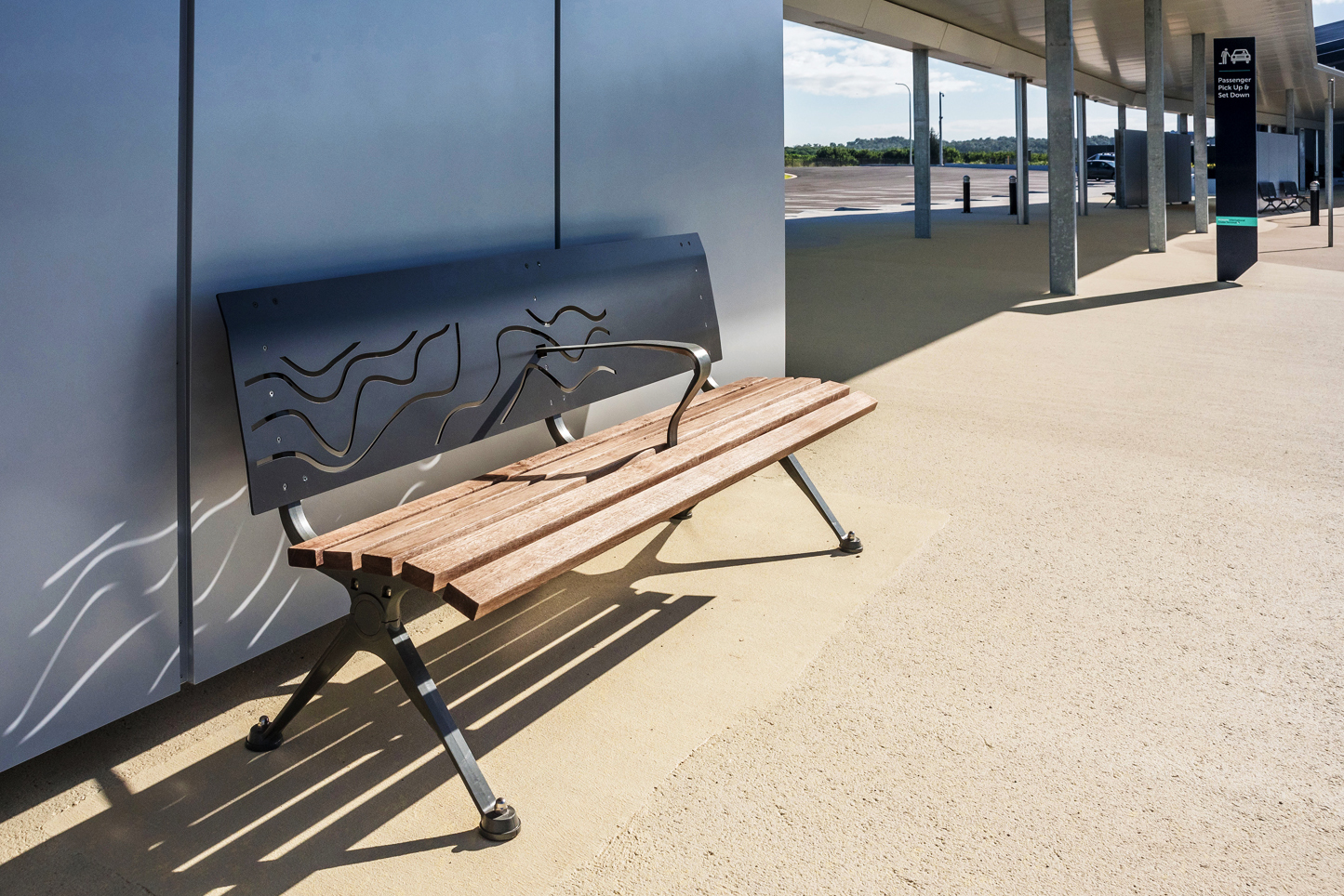 Mall DDA Seat (CMM7) with custom backrest in Monument, Jarrah battens and Woodland Grey frame.