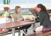 Mall Table, wheelchair access on one end, Jarrah battens and Palladium Silver frame.
