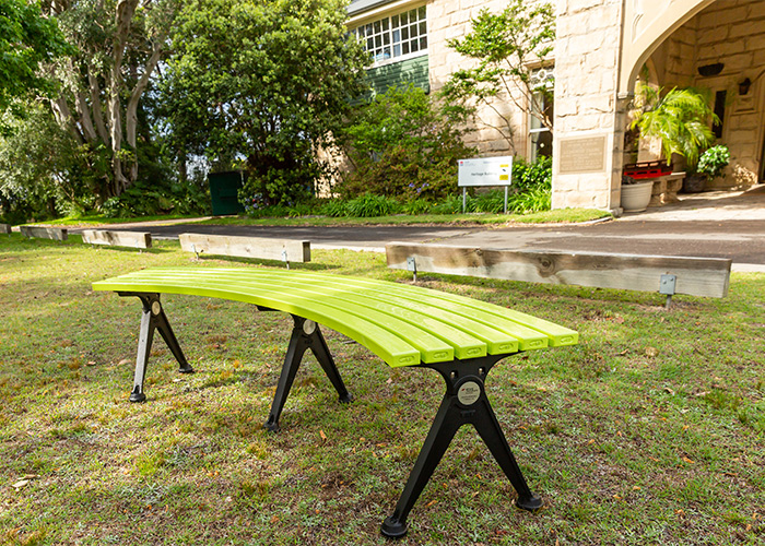 Mall Curved Slim Bench, powdercoated in Lycra Strip green with Night Sky frames.