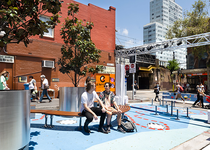 Mall Curved Slim Bench (CMM8-C) with aluminium Bush Cherry battens, Palladium Silver frame.