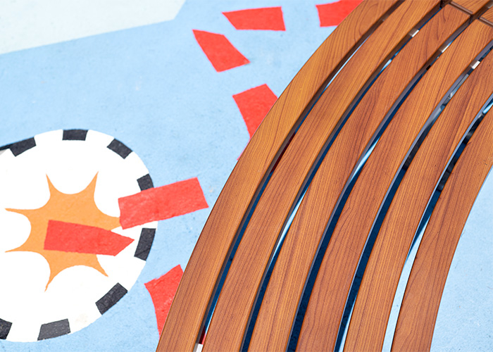 Mall Curved Slim Bench (CMM8-C) with aluminium Bush Cherry battens, Palladium Silver frame.