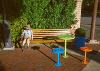 Mall Seat (CMM1, 1750mm) with aluminium Spotted Gum battens, Textura Monument frame. With Frame Planter, Cafe Macchiato Tables and Stools.