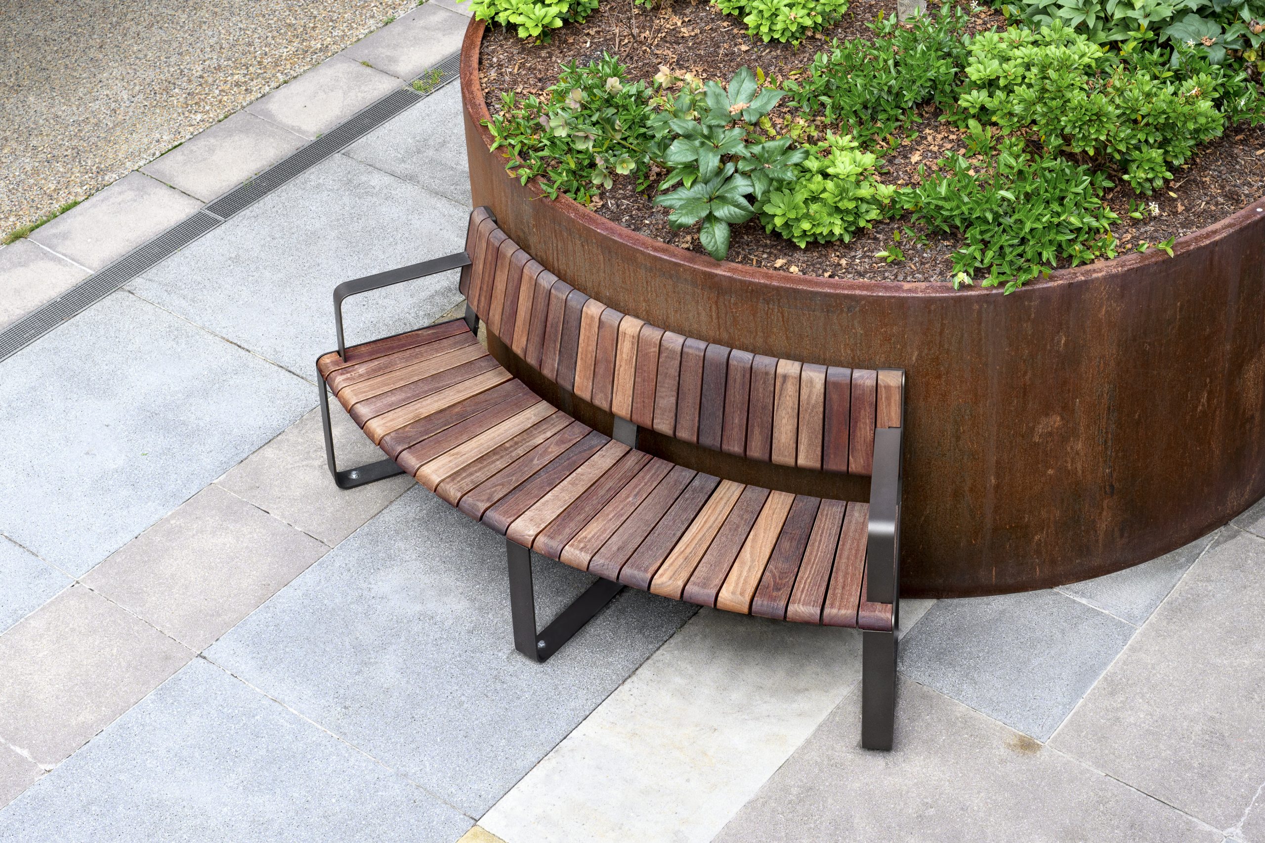Curved Linea VT Seat - Convex (LVS10-C) surface fixed, with Jarrah hardwood battens, Textura Dark Bronze frame