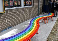Three colourful Mall Curved Slim Benches make up the rainbow seat.