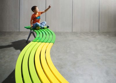 Mall Curved Slim Bench with Sable Brilliance frame, battens in Viper Green, Lycra Strip and Brilliant Yellow.