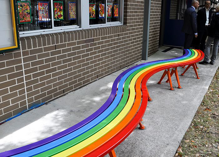 Mall Curved Slim Benches with rainbow battens, Sensation Orange frame.