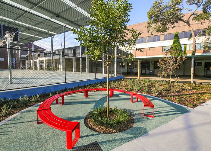 Tailored circular bench in Lobster Red for the upgraded Randwick Public School campus.