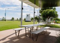 Custom Picnic Setting designed by Urbis, with anodised aluminium battens and stainless steel frame.