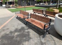 Aria Seats, battens in aluminium woodgrain Spotted Gum, with Textura Monument frames.