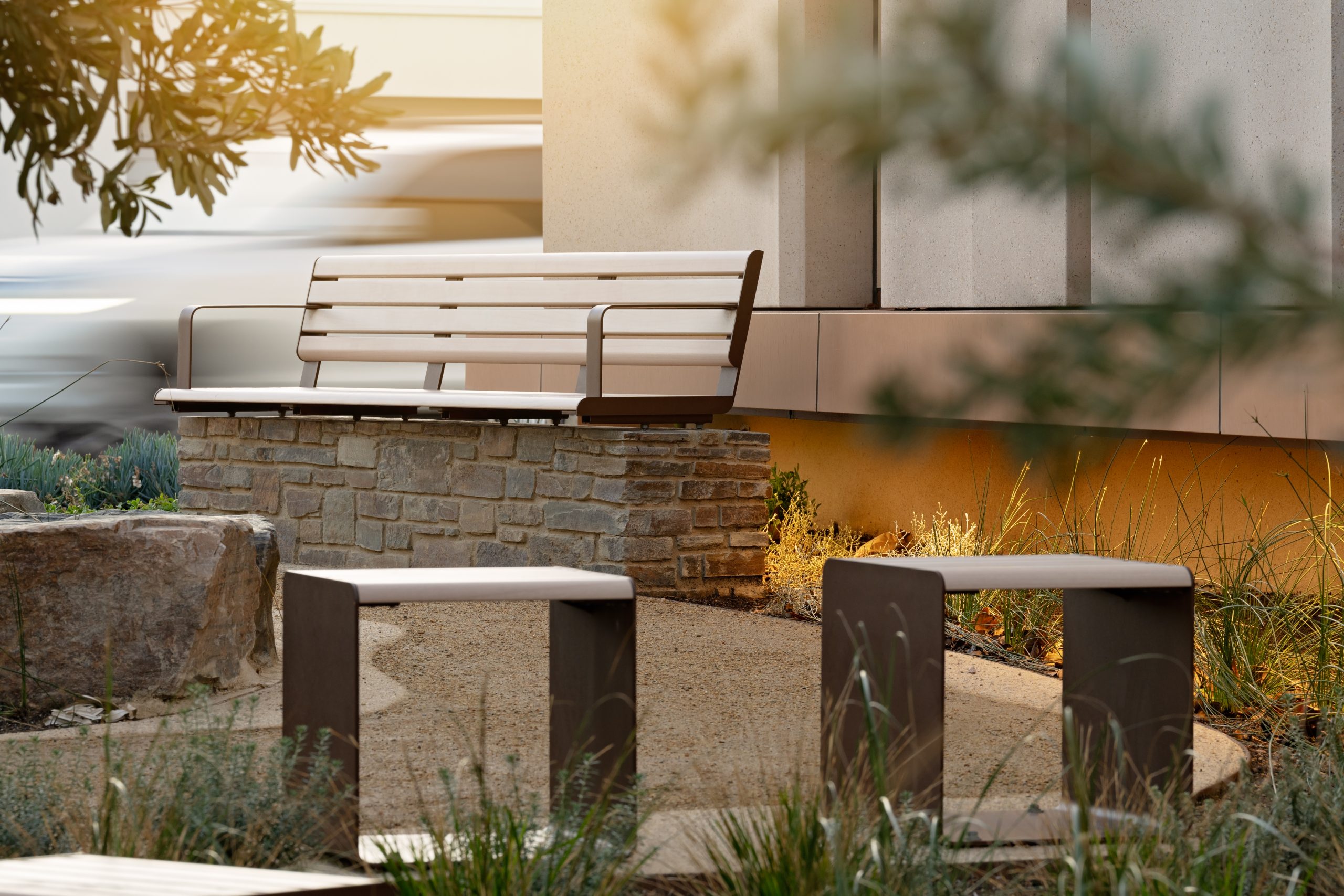 Linea Seat (2100mm, plinth-fixed, arms) and Cube, aluminium Curly Birch battens, Textura Core Ten frames.