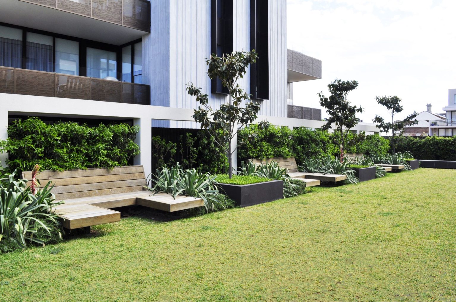 Custom day beds on the lawn at Warleigh Grove, Brighton.
