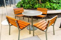 Forum Seats and Cafe Table in aluminium woodgrain Bush Cherry, and Woodland Grey.