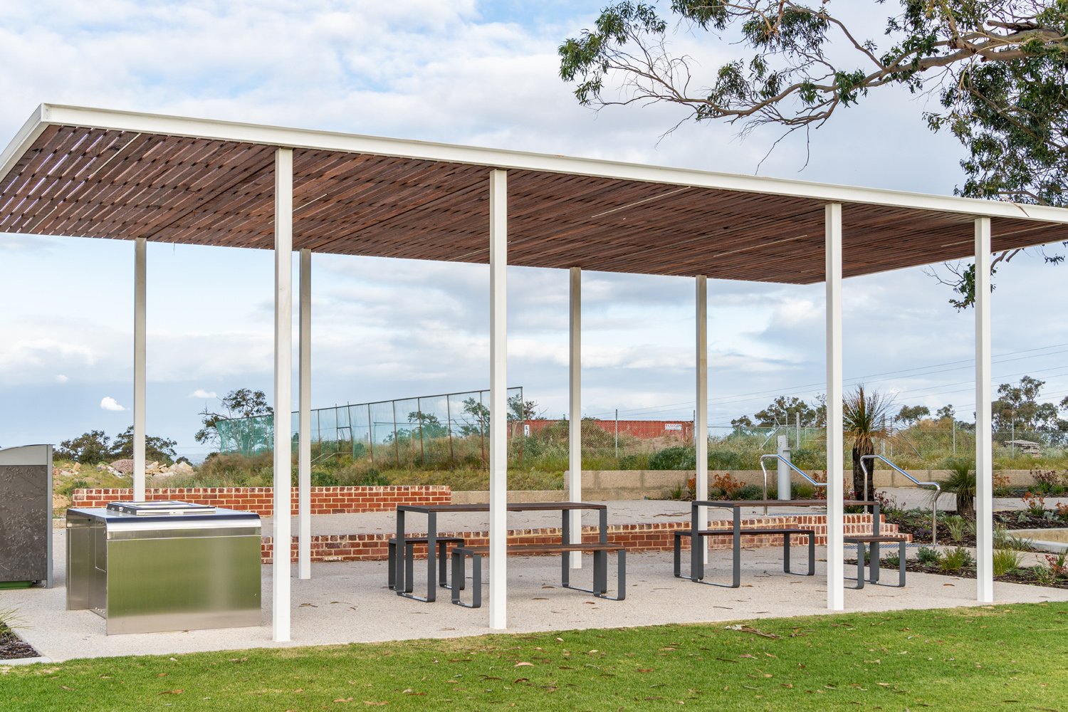 Linea Setting with Table (LIT10-DDA, 1800mm) and Benches (LIB6) with hardwood battens, Ironstone frame.