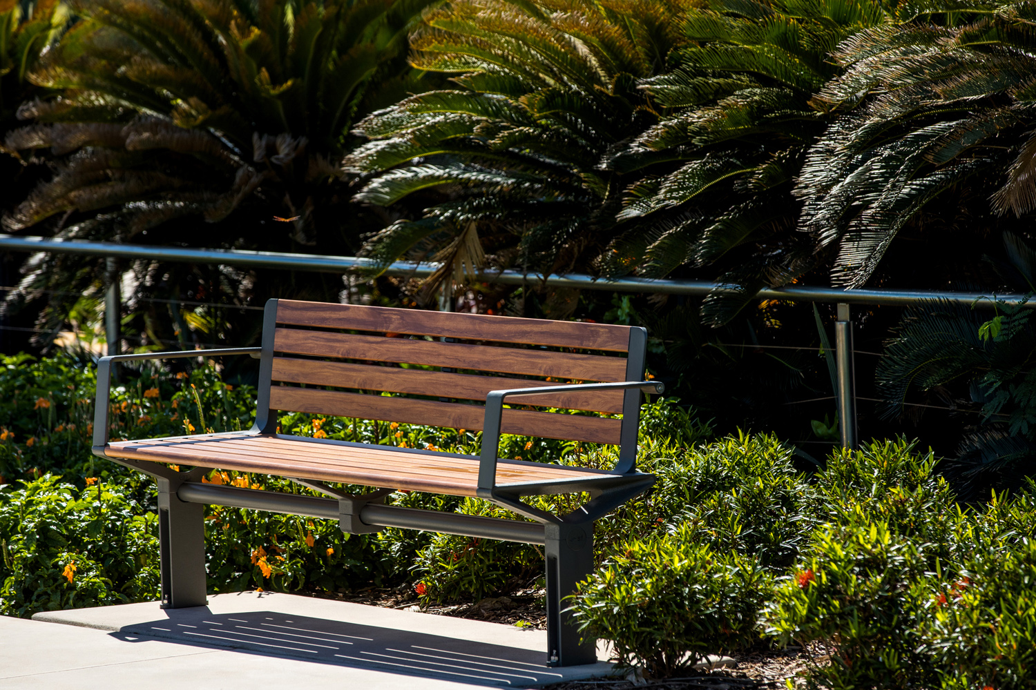 Aria Seat (CMA1) 3-seater with battens in aluminium woodgrain Spotted Gum, Textura Woodland Grey frame.