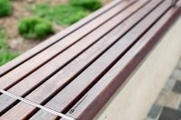Linea Bench (LIB6, 1800mm) plinth-fixed with hardwood battens, Jasper frames.