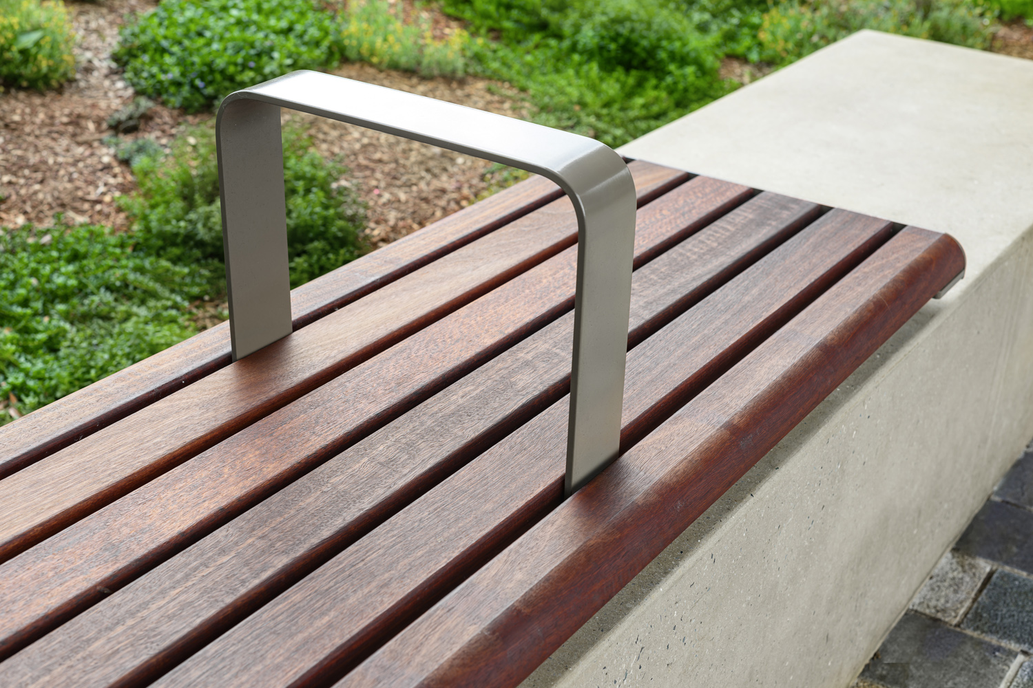 Linea Bench (LIB6, 1800mm) plinth-fixed with hardwood battens, Jasper frames.