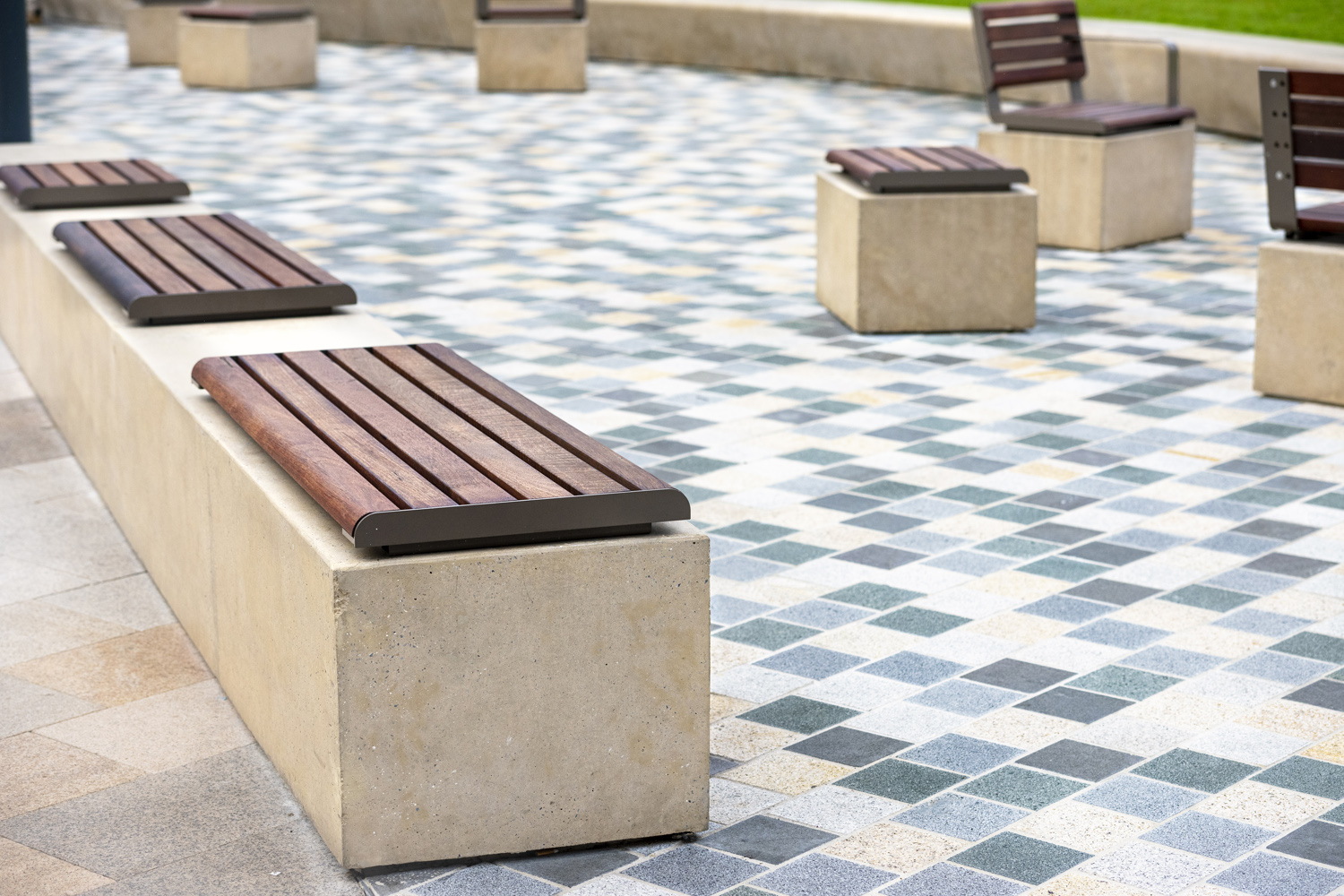 Linea Seats and Benches (600mm, 1200mm) plinth-fixed with hardwood battens, Jasper frames.