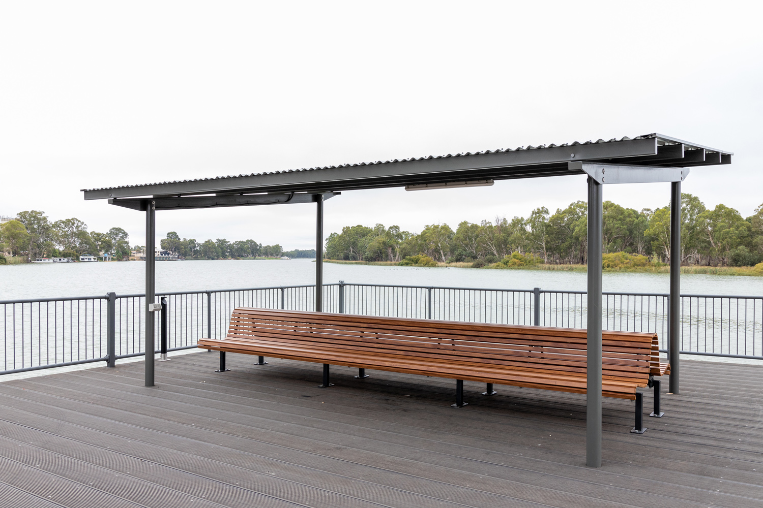 Classic Plaza Back-to-Back Seat with aluminium woodgrain battens in Spotted Gum, Sable Bass frame.