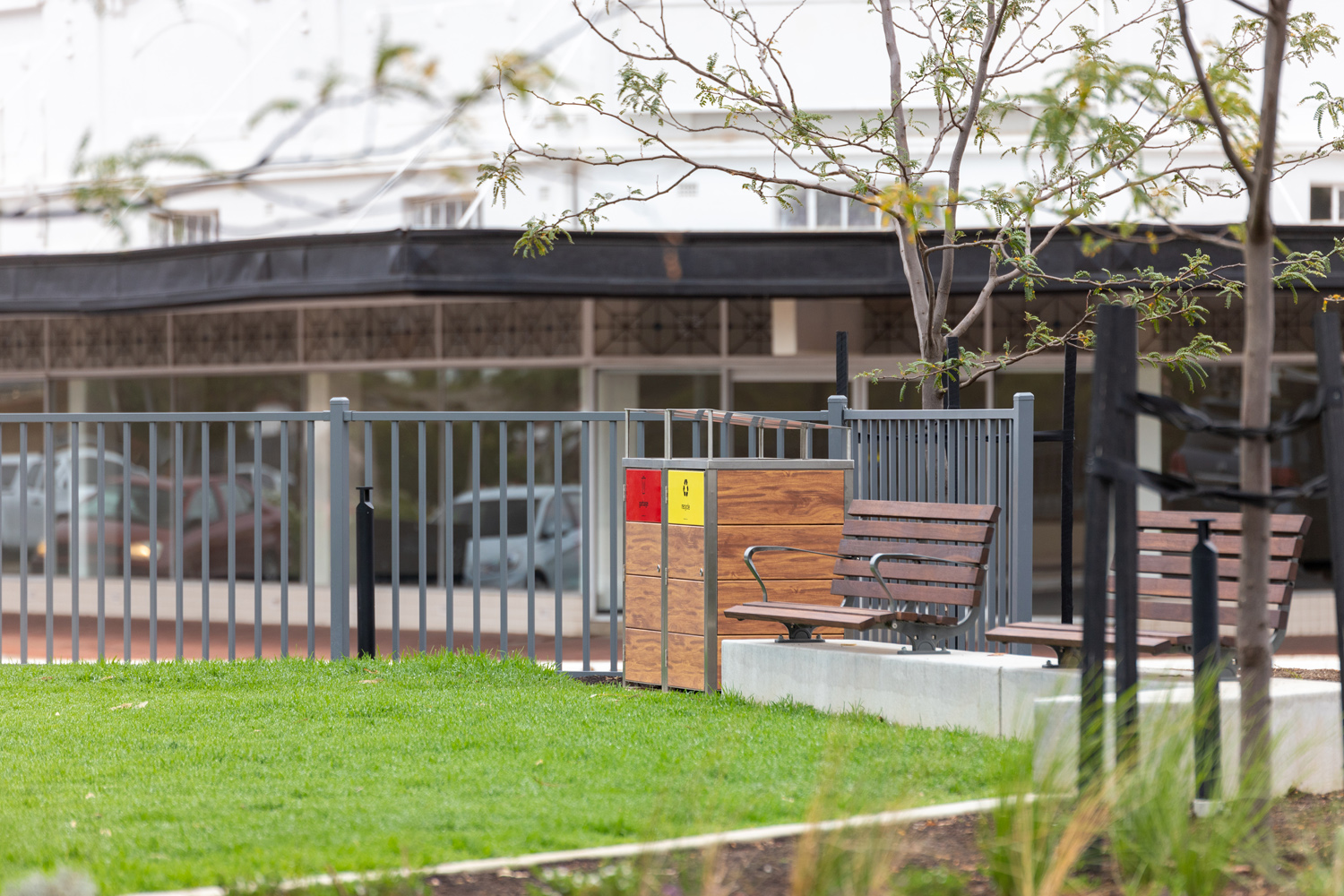 Frame Bin Enclosure with custom battened body in aluminium woodgrain in Spotted Gum.