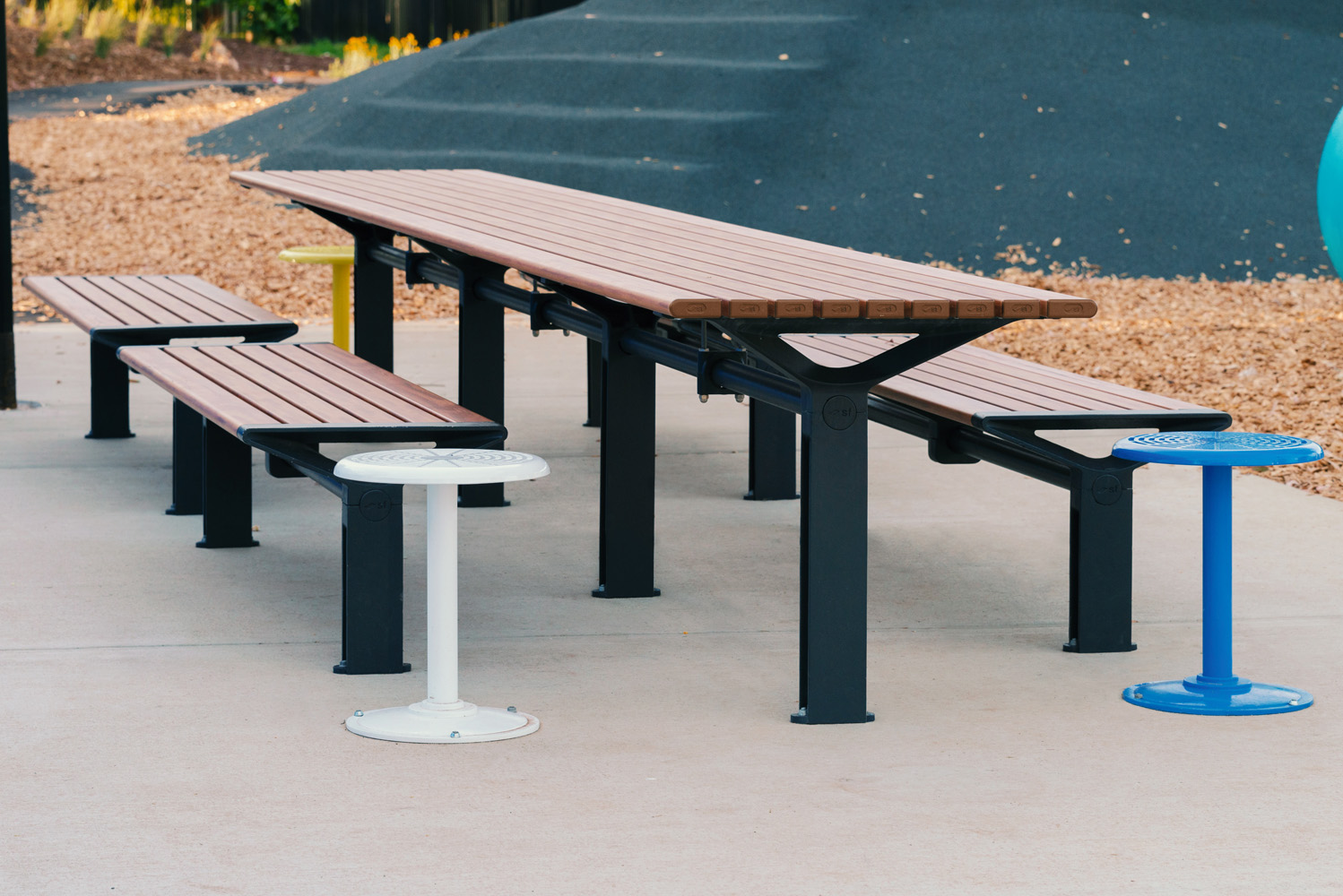 Aria Long Communal Table (CMA6-L) with aluminium Spotted Gum battens, Textura Monument frames.