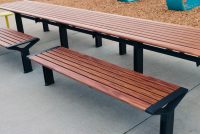 Aria Long Communal Table (CMA6-L) with aluminium Spotted Gum battens, Textura Monument frames.