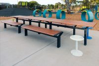 Aria Long Communal Table (CMA6-L) with aluminium Spotted Gum battens, Textura Monument frames.