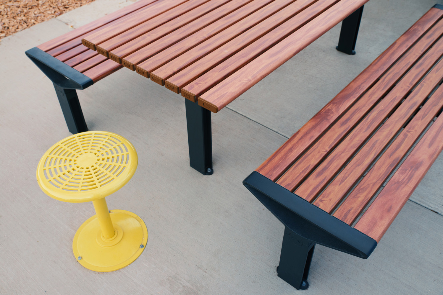 Aria Long Communal Table (CMA6-L) with aluminium Spotted Gum battens, Textura Monument frames.