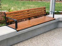 Linea Seat (LIS10) 1800mm with aluminium woodgrain Spotted Gum battens, Monument frame, plinth-fixed.