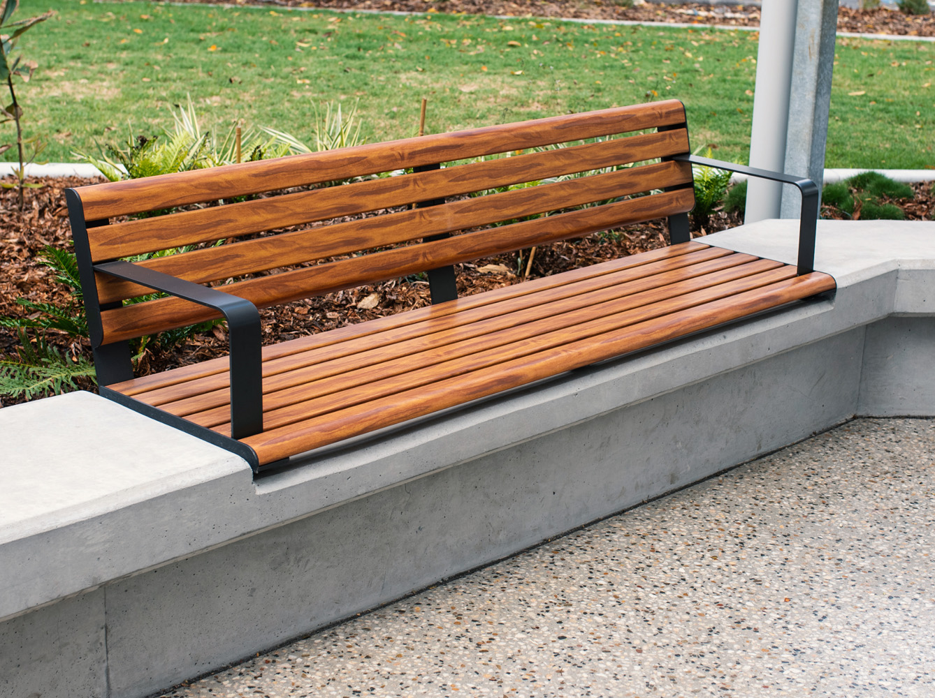 Linea Seat (LIS10) 1800mm with aluminium woodgrain Spotted Gum battens, Monument frame, plinth-fixed.