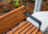 Linea Seat (LIS10) 1800mm with aluminium woodgrain Spotted Gum battens, Monument frame, plinth-fixed.