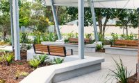 Linea Seat (LIS10) 1800mm with aluminium woodgrain Spotted Gum battens, Monument frame, plinth-fixed.