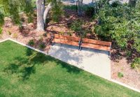 Linea Seat (LIS10) 1800mm with aluminium woodgrain Spotted Gum battens, Monument frame.