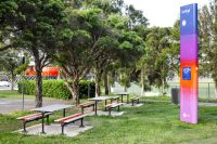 Mall Setting (CMM6) with Slim Benches (CMM8), Textura Silver and Sensation Orange battens, Charcoal frame.