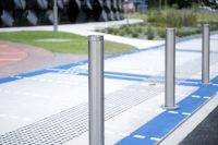 Slim Bollard (B5-F) in stainless steel 304, No.4 finish (brushed) with flat polished top.
