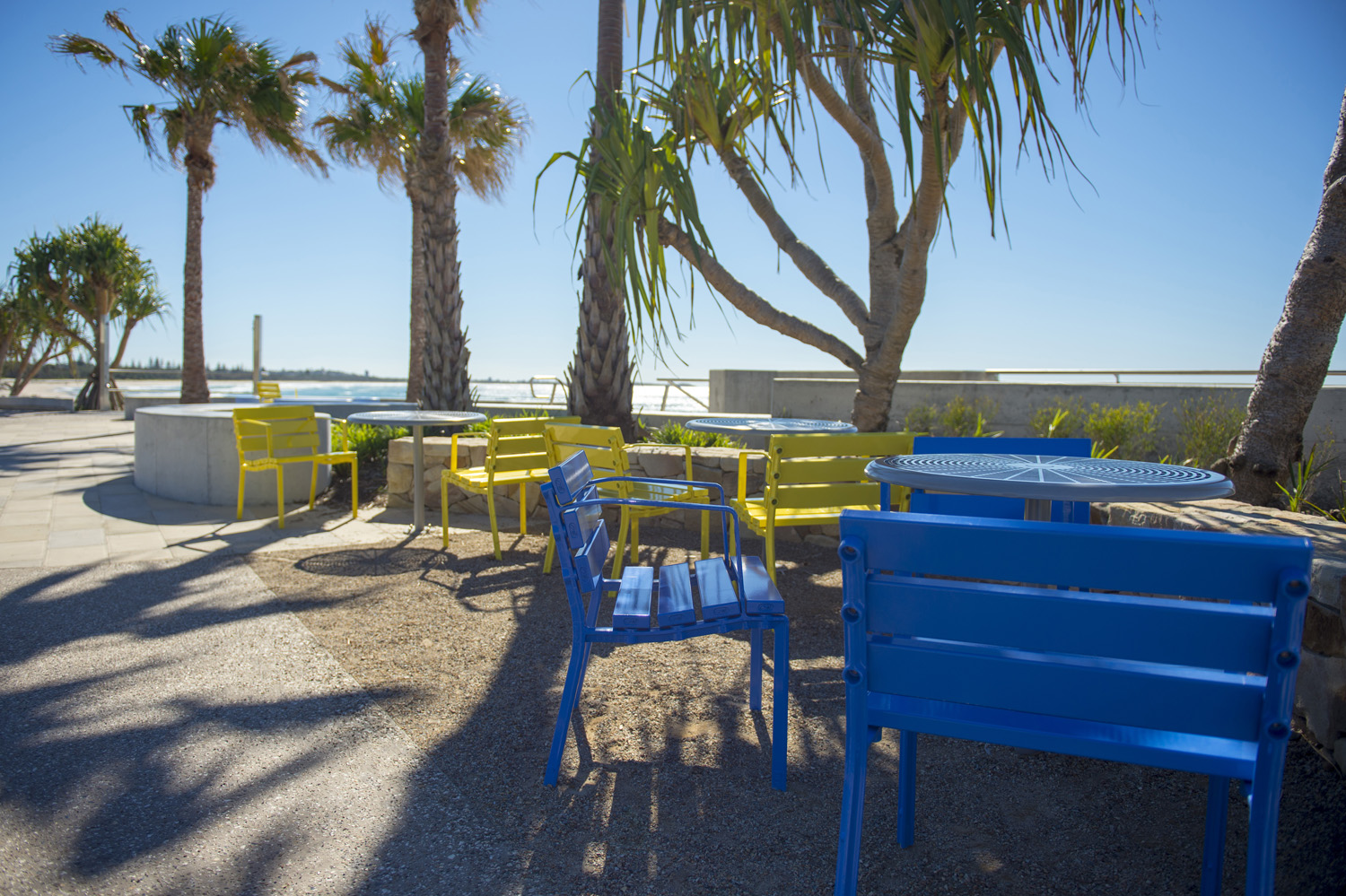 Forum Seats and Cafe Tables in Bondi Blue, Brilliant Yellow and Palladium Silver.