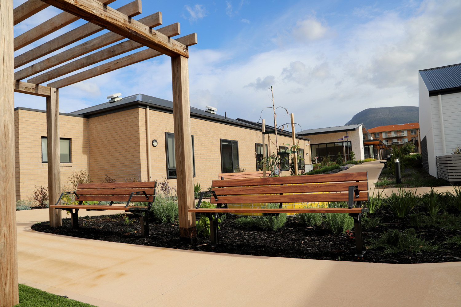 Park DDA Seats (PS7-DDA) with aluminium woodgrain Spotted Gum battens, Night Sky frames.