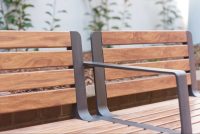 Aria Seat, woodgrain aluminium battens in Spotted Gum, frame in Textura Monument.