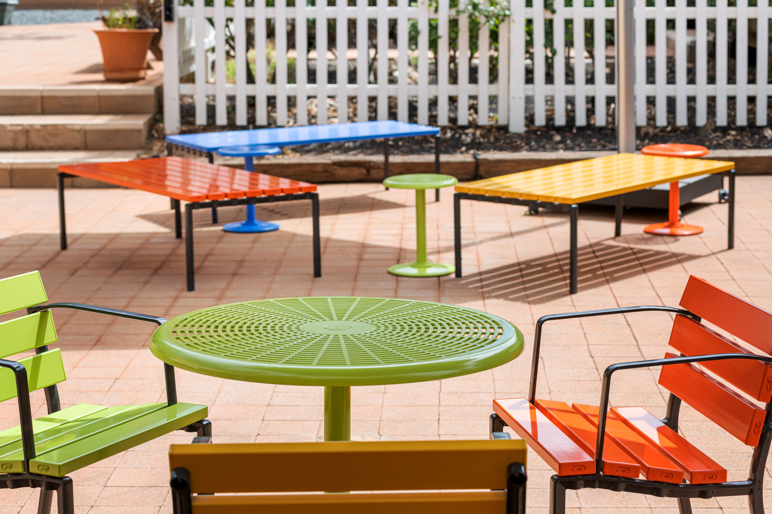 Cafe Round Table and Forum Seats in Lycra Strip, Sunshine, Sensation Orange and Bondi Blue.
