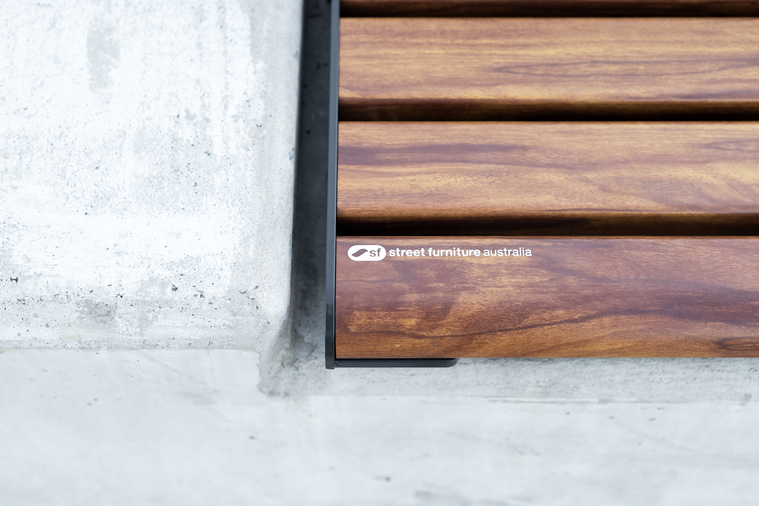 Olds-Park_Street-Furniture-Australia_0-15 - Street Furniture Australia Linea Seat (LIS10) detail, plinth-fixed with aluminium woodgrain Spotted Gum battens, Monument frame.