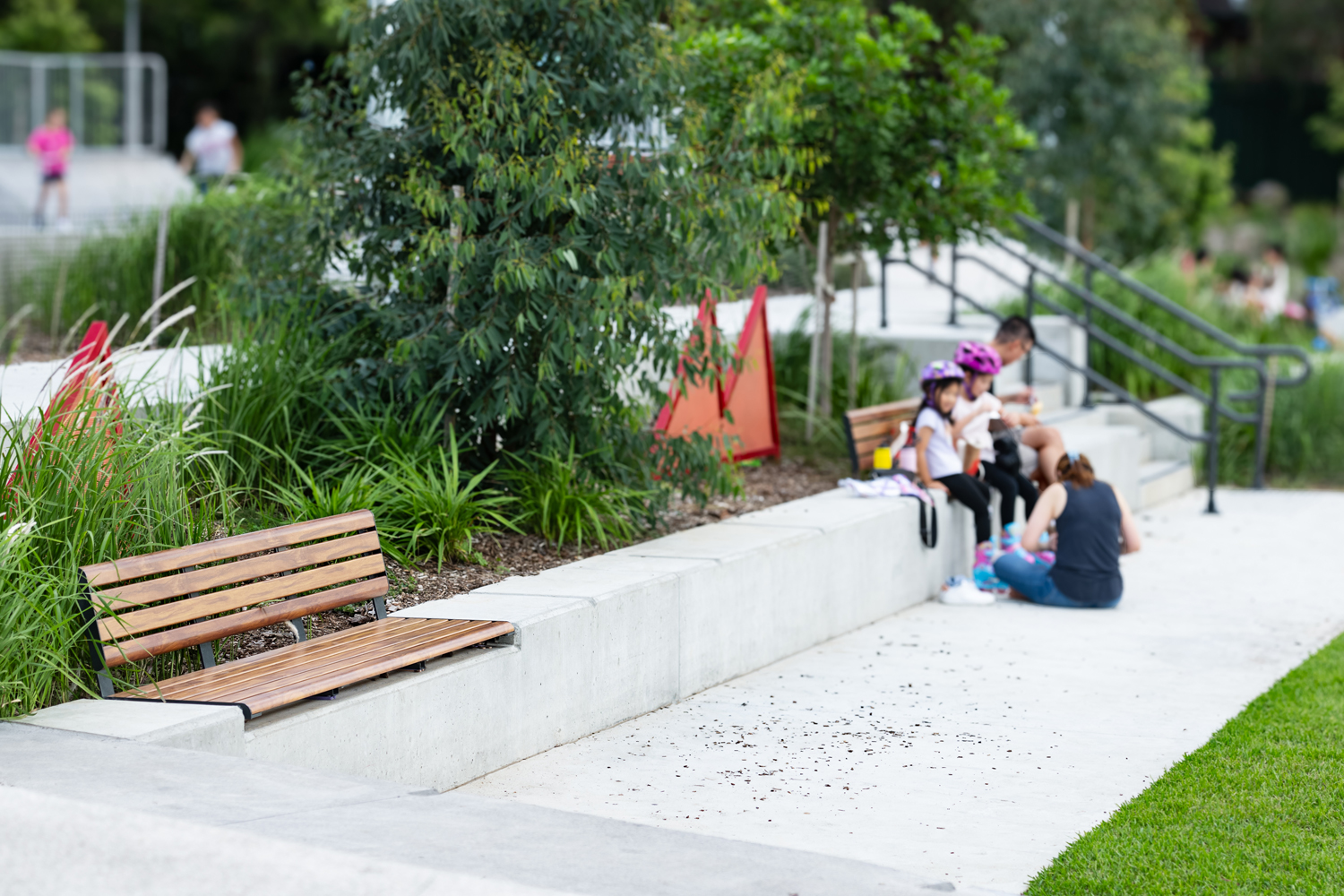Olds-Park_Street-Furniture-Australia_0-2-1 - Street Furniture Australia Linea Seat (LIS10, 2100mm) plinth-fixed with aluminium woodgrain Spotted Gum battens, Monument frame.