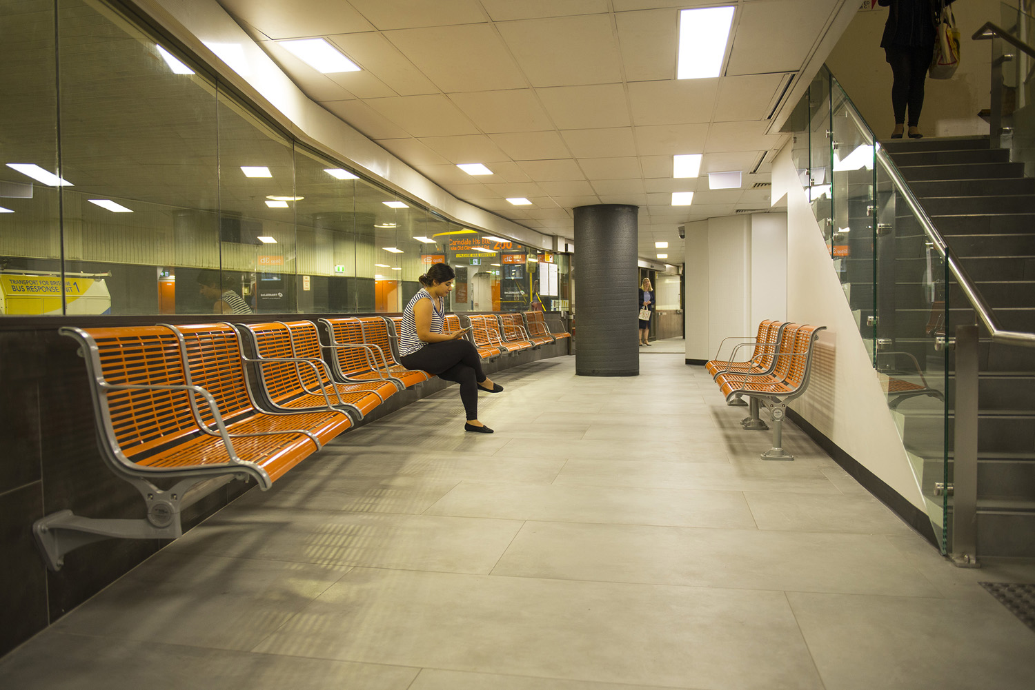 TransLink's bright orange Concourse Seats add warmth and comfort to the refurbished station.