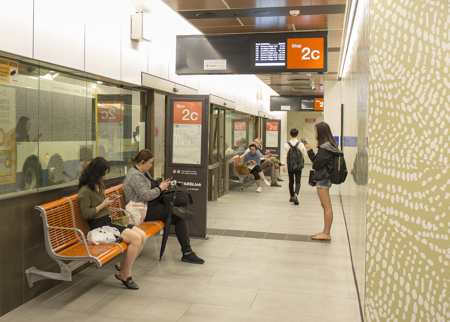 TransLink's bright orange Concourse Seats add warmth and comfort to the refurbished station.