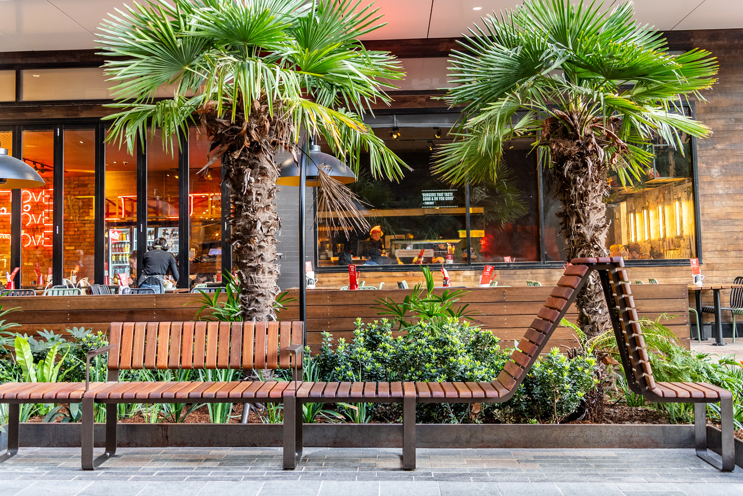 Tailored Linea VT seating system with Spotted Gum hardwood battens, Textura Dark Bronze frame.