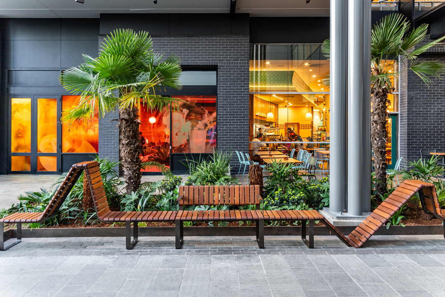 Tailored VT seating system with Spotted Gum hardwood battens, Textura Dark Bronze frame.