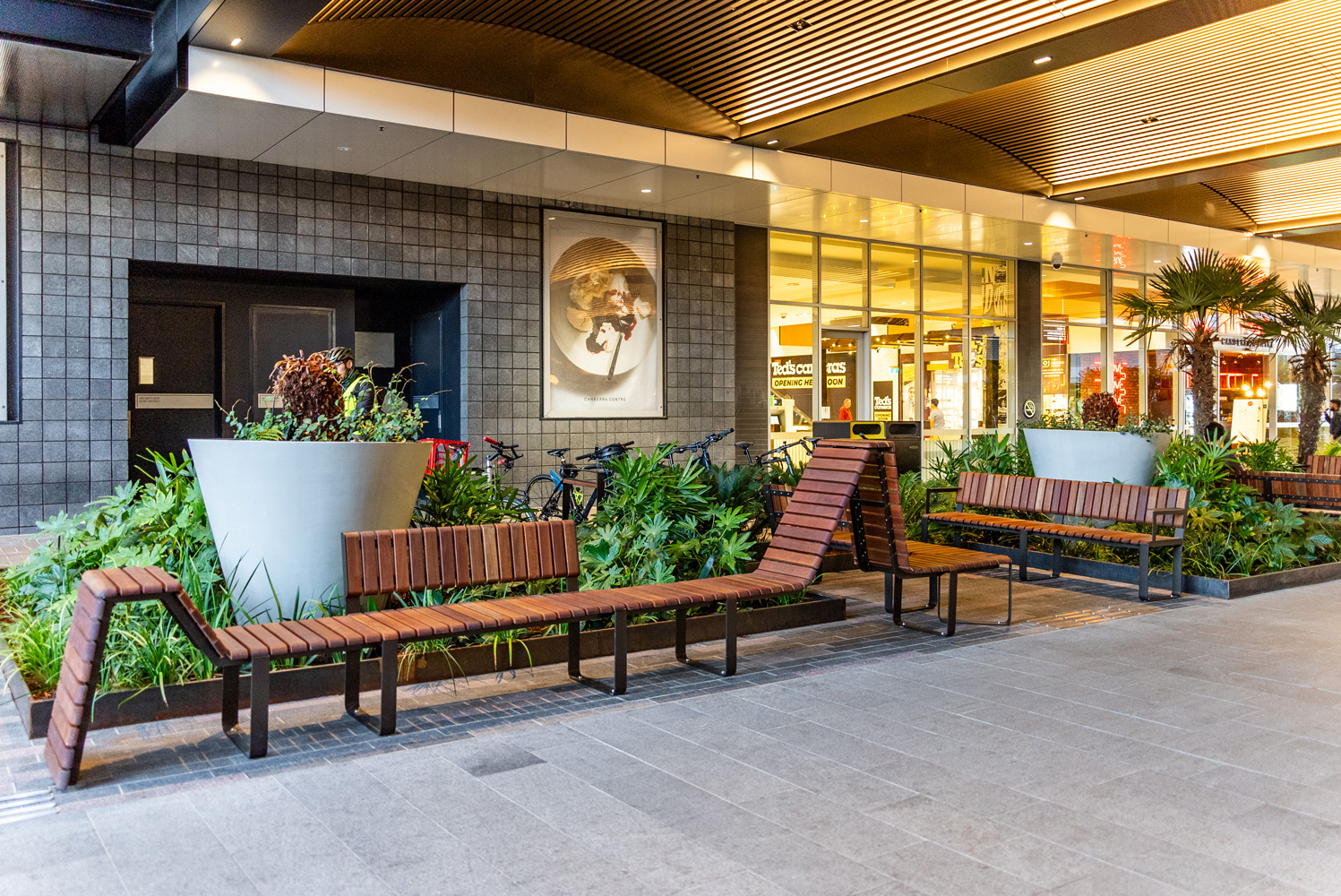 Tailored Linea VT seating system with Spotted Gum hardwood battens, Textura Dark Bronze frame.