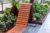 Tailored Linea VT seating system with Spotted Gum hardwood battens, Textura Dark Bronze frame.